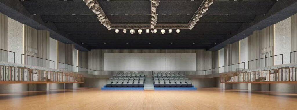 Explore a theater acoustic treatment project in Bangladesh using grooved wood, upholstered, and suspended polyester fiber acoustic panels for reverberation control and acoustic comfort.